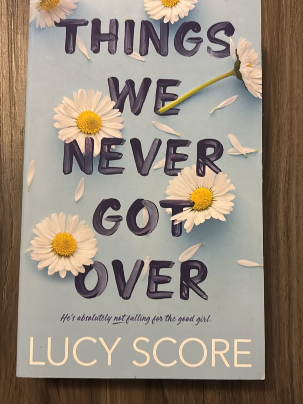 Things We Never Got Over by Lucy Score - Blue Cover with Daisies